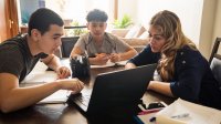 Mother working with her two sons during distance learning