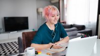 Teenage girl distance learning on laptop at home