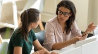 Two female colleagues talking 