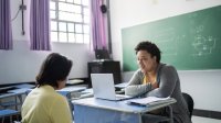 Photo of teacher talking to student