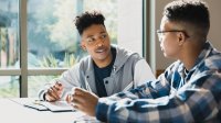 Two students talking in class