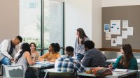 Photo of high school teacher and students in classroom