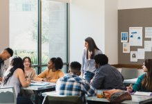 Photo of high school teacher and students in classroom