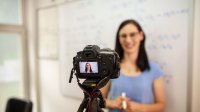 Photo of teacher videotaping lecture