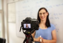 Photo of teacher videotaping lecture