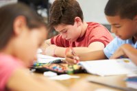 Middle school students reading in class