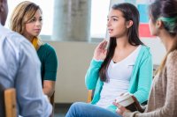 A group of students talking in a restorative circle