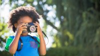 Photo of elementary student with camera