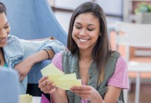 High school students study with flash cards