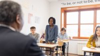 Middle school student standing in classroom