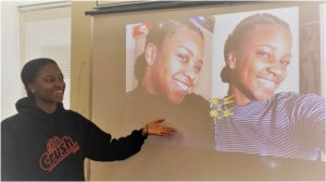 Student displays photos of her sister