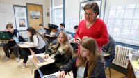 Photo of high school teacher and students in classroom