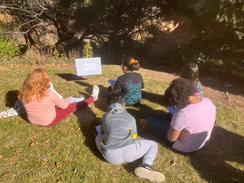 Photo of students having lesson outside