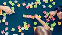 Photo of students spelling words with blocks