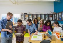 Photo of middle school teacher and students in science class