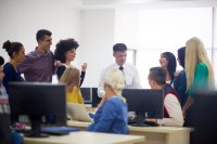 High school teacher facilitating a morning meeting with his students