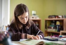 Adolescent girl doing homework.