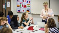 Photo of middle school teacher and students in classroom