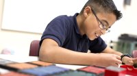 A student at work in class on a project of his choosing