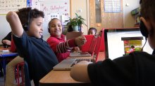 Students working on laptops.