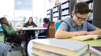 Students read in a school library.