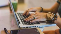 Woman typing on laptop