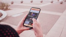 Woman looking at Ted Talk on her phone