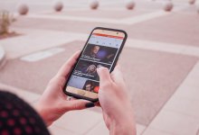 Woman looking at Ted Talk on her phone