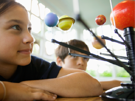 Girl learning about solar system