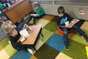 Boys work in a flexible seating arrangement.